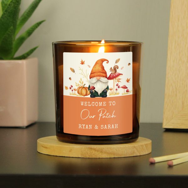 Personalised amber glass candle with autumn gonk label