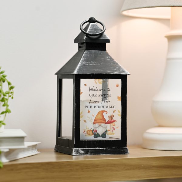 Personalised autumn gonk LED lantern with warm orange flame effect and hanging hoop